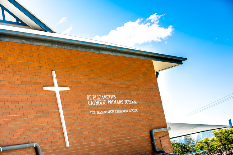 St Elizabeth’s Catholic Primary School building with a cross and school signage, representing Catholic identity heritage and a welcoming learning environment